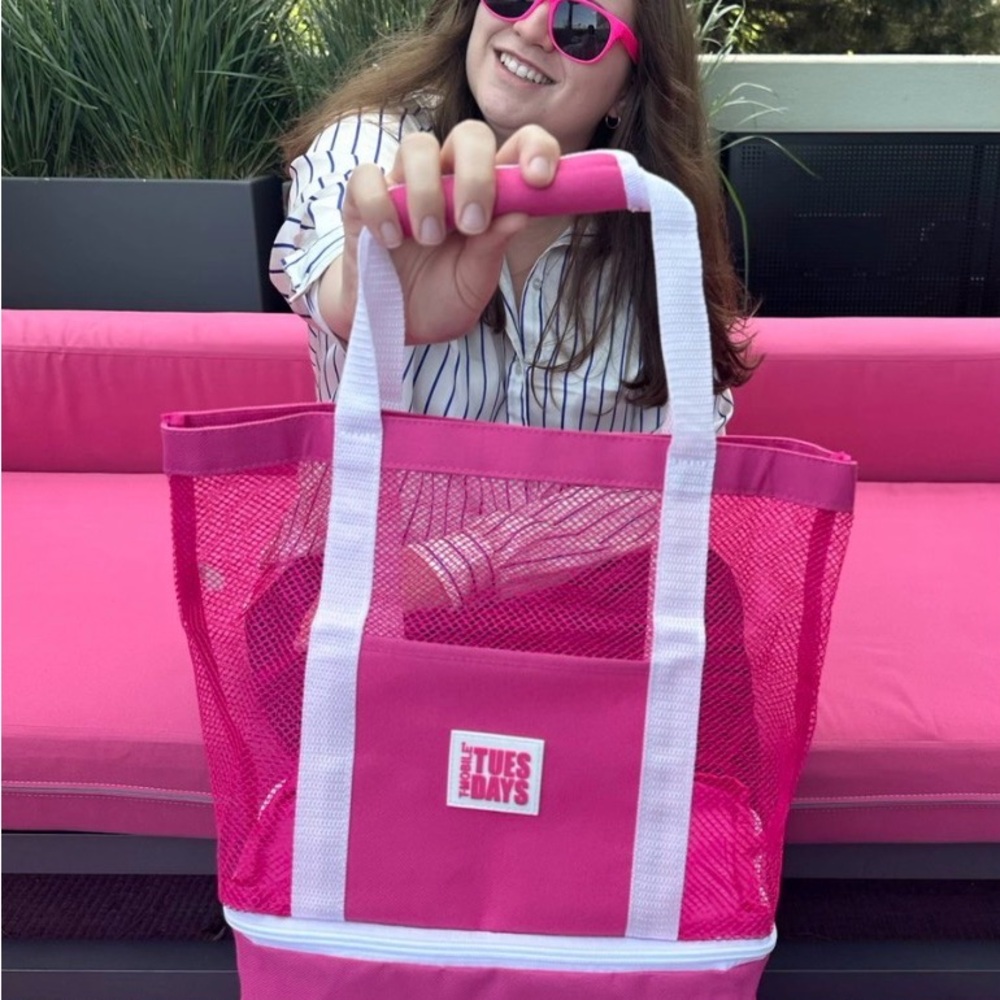 Hot pink mesh tote bag with white straps